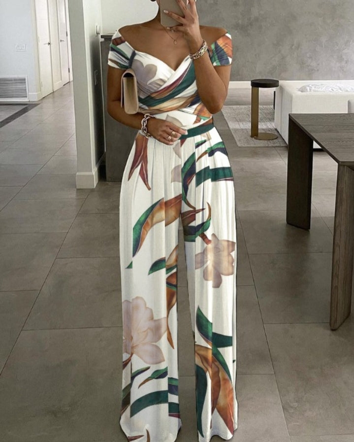 Premièrement : Adoptez un look frais et élégant avec cette Combinaison à jambes larges et épaules dénudées à imprimé plantes femme.