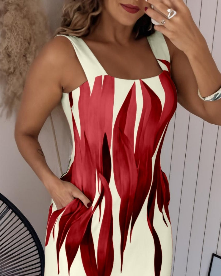 Premièrement : Cette robe longue décontractée à bretelles épaisses et imprimé végétal, coupe ajustée et fendue avec poches Femme.