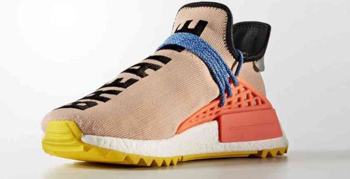 les baskets Adidas Human Race NMD x Pharrell Yellow " Femme  sont un témoignage de l'engagement d'Adidas à combiner style et innovation.