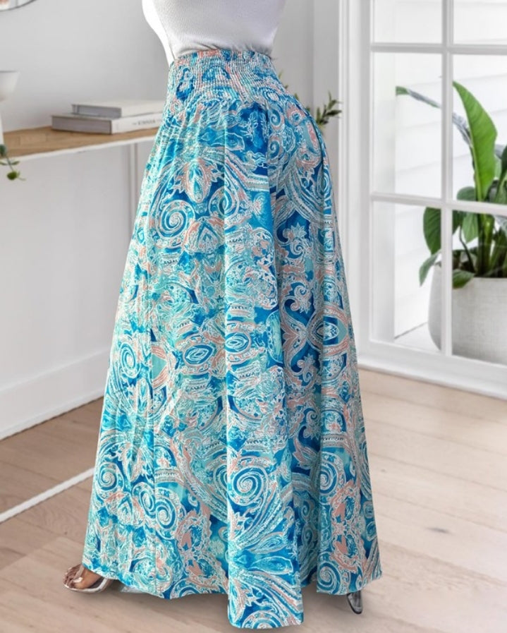 Premièrement : Le Pantalon larges , taille haute, à imprimé tropical femme, est la pièce parfaite pour insuffler une touche d’exotisme à votre garde-robe.
