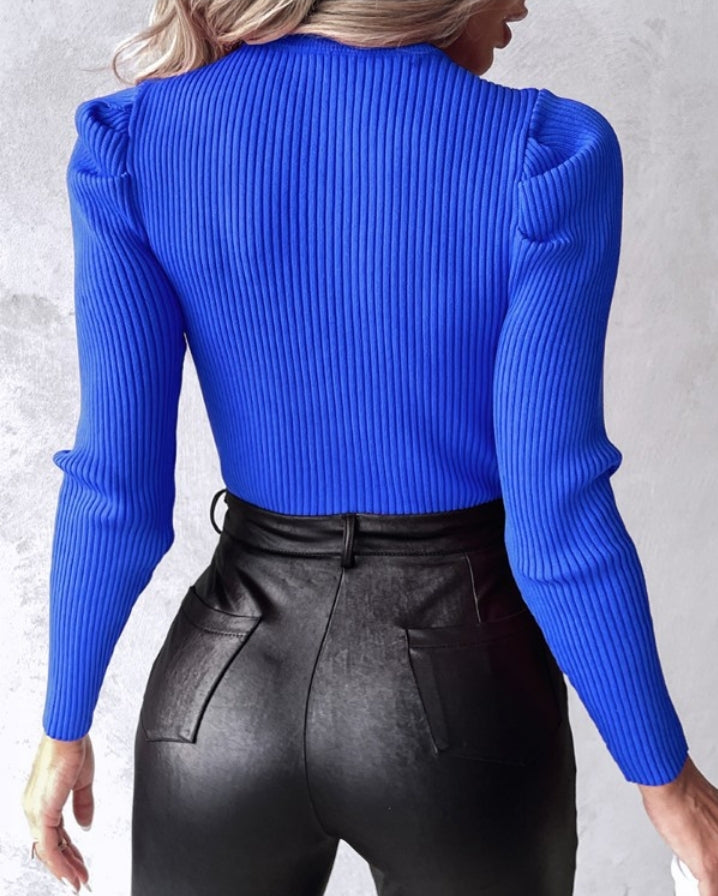 Knit sweater with keyhole neck and studded rhinestones
