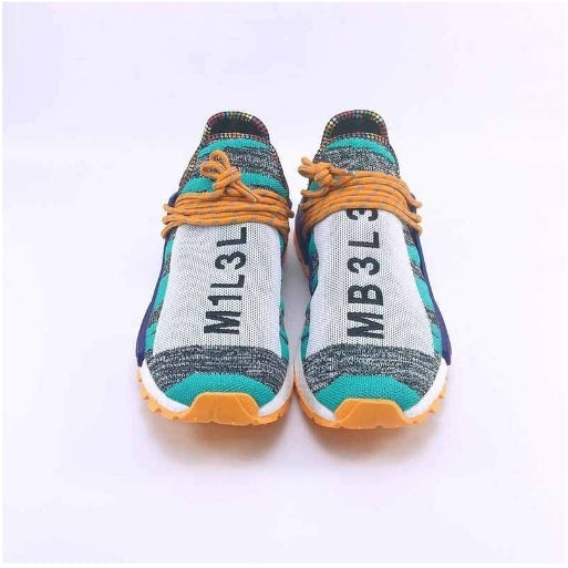 les baskets Adidas Human Race NMD x Pharrell Yellow " Femme  sont un témoignage de l'engagement d'Adidas à combiner style et innovation.