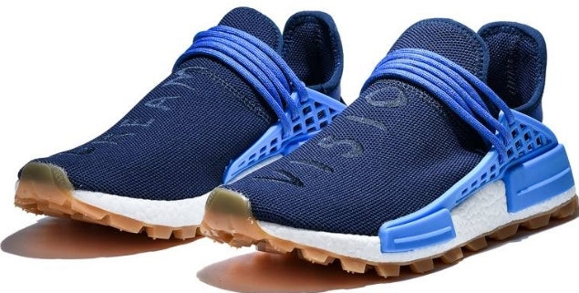 les baskets Adidas Human Race NMD x Pharrell Yellow " Femme  sont un témoignage de l'engagement d'Adidas à combiner style et innovation.