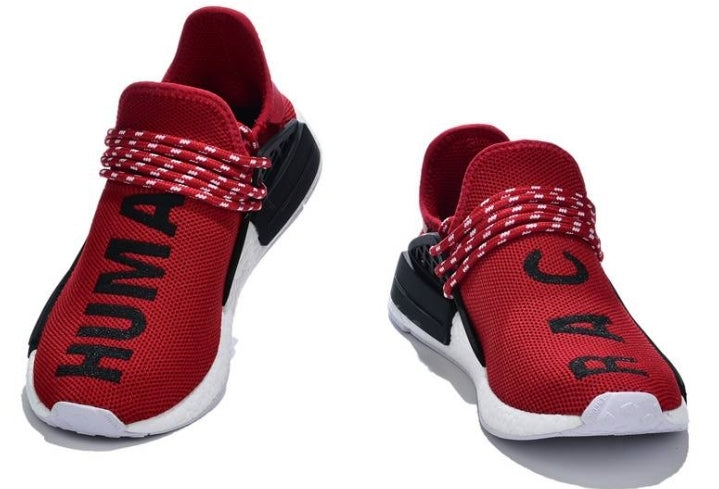 les baskets Adidas Human Race NMD x Pharrell Yellow " Femme  sont un témoignage de l'engagement d'Adidas à combiner style et innovation.