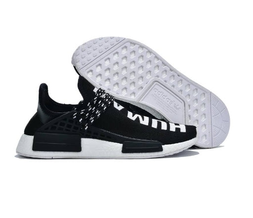 les baskets Adidas Human Race NMD x Pharrell Yellow " Femme  sont un témoignage de l'engagement d'Adidas à combiner style et innovation.