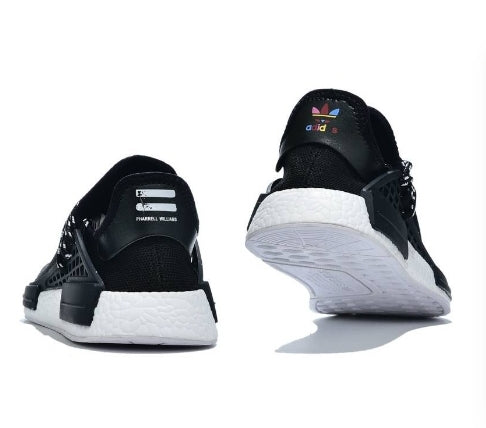 les baskets Adidas Human Race NMD x Pharrell Yellow " Femme  sont un témoignage de l'engagement d'Adidas à combiner style et innovation.