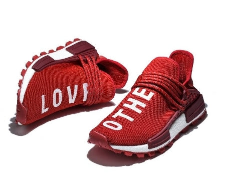 les baskets Adidas Human Race NMD x Pharrell Yellow " Femme  sont un témoignage de l'engagement d'Adidas à combiner style et innovation.