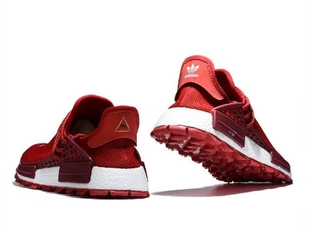 les baskets Adidas Human Race NMD x Pharrell Yellow " Femme  sont un témoignage de l'engagement d'Adidas à combiner style et innovation.