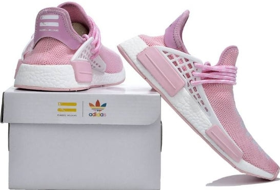 les baskets Adidas Human Race NMD x Pharrell Yellow " Femme  sont un témoignage de l'engagement d'Adidas à combiner style et innovation.