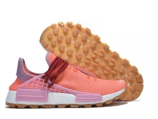 les baskets Adidas Human Race NMD x Pharrell Yellow " Femme  sont un témoignage de l'engagement d'Adidas à combiner style et innovation.