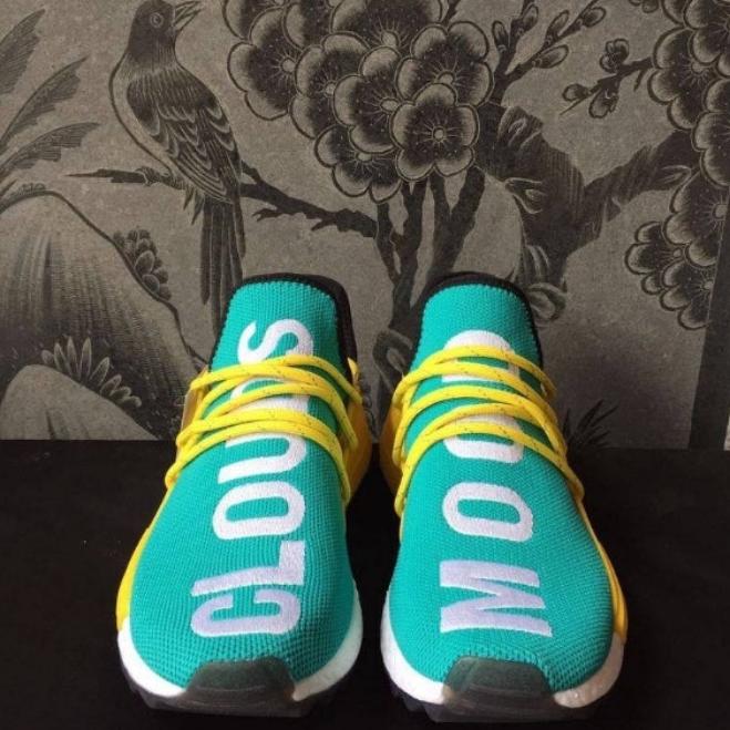 les baskets Adidas Human Race NMD x Pharrell Yellow " Femme  sont un témoignage de l'engagement d'Adidas à combiner style et innovation.