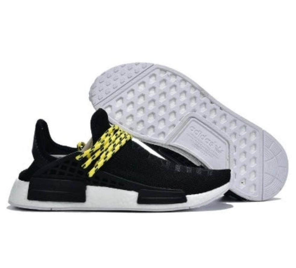 les baskets Adidas Human Race NMD x Pharrell Yellow " Femme  sont un témoignage de l'engagement d'Adidas à combiner style et innovation.