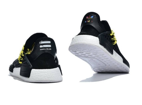 les baskets Adidas Human Race NMD x Pharrell Yellow " Femme  sont un témoignage de l'engagement d'Adidas à combiner style et innovation.