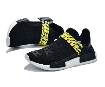 les baskets Adidas Human Race NMD x Pharrell Yellow " Femme  sont un témoignage de l'engagement d'Adidas à combiner style et innovation.