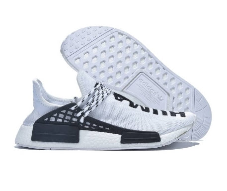 les baskets Adidas Human Race NMD x Pharrell Yellow " Femme  sont un témoignage de l'engagement d'Adidas à combiner style et innovation.