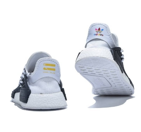 les baskets Adidas Human Race NMD x Pharrell Yellow " Femme  sont un témoignage de l'engagement d'Adidas à combiner style et innovation.