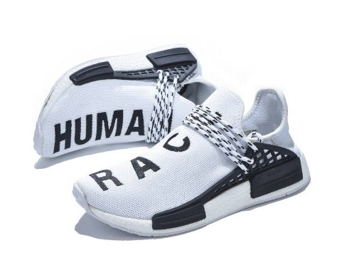 les baskets Adidas Human Race NMD x Pharrell Yellow " Femme  sont un témoignage de l'engagement d'Adidas à combiner style et innovation.