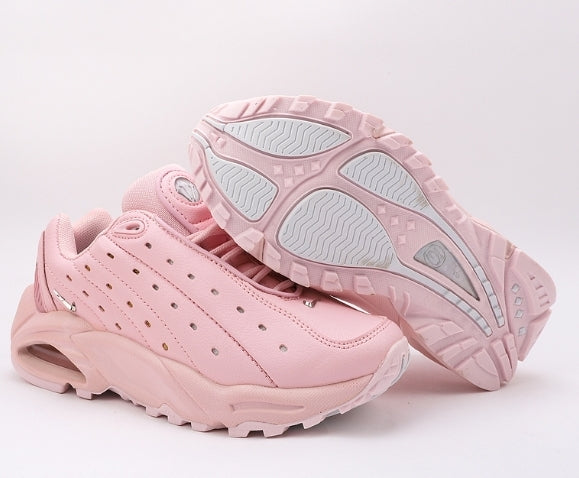 Les baskets Nike Hot Step Air Terra x NOCTA "Pink" Femme, issues de la collaboration entre Nike et NOCTA.